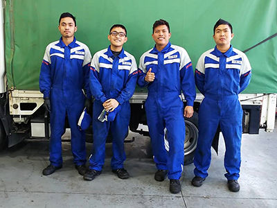 These graduates work at Isuzu dealerships in Japan